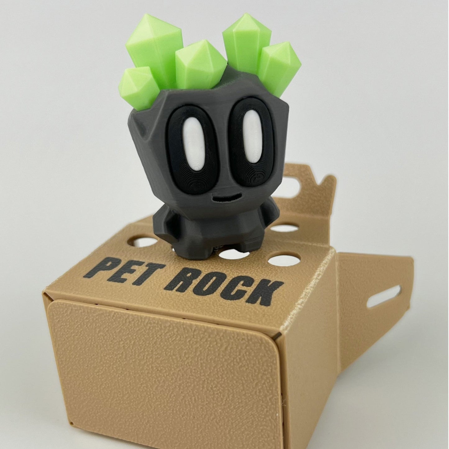Figurina Pet Rock 3D, cu Cristale Fosforescente si Cutie de Depozitare